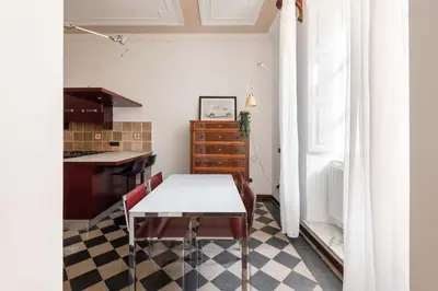 a small kitchen with a table and a counter at Maison Leo a S. Maria Maggiore in Rome