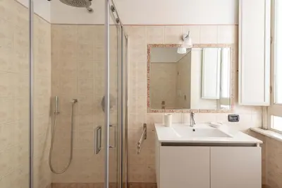 a bathroom with a sink and a shower at Maison Leo a S. Maria Maggiore in Rome
