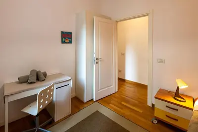 a room with a desk and a chair and a door at Domus Villa Scipioni in Rome