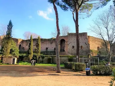 a large brick building with trees in a park at Domus Villa Scipioni in Rome