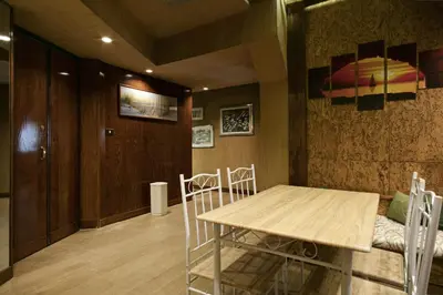 a dining room with a table and chairs at Back to 70's-Modern and Terrace in Rome