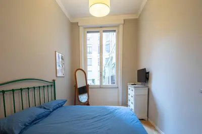 a bedroom with a bed and a window at Luna's Apartment BuddyRent in Rome