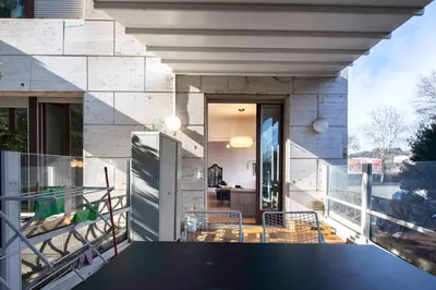 a balcony of a house with a table and chairs at Luna's Apartment BuddyRent in Rome