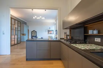 a large kitchen with a counter top and a stove at Luna's Apartment BuddyRent in Rome