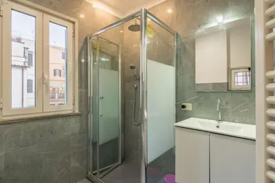 a bathroom with a shower and a sink at JOIVY Lovely Flats Next To Fontana di Trevi in Rome