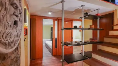 a room with shelves and stairs in a room at Borgo Vittorio - exclusive residence in the heart of Rome in Rome