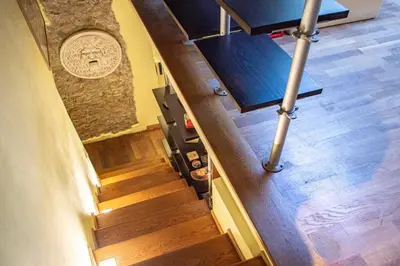 an overhead view of a staircase with wooden floors at Borgo Vittorio - exclusive residence in the heart of Rome in Rome