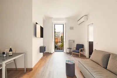 a living room with a couch and a table at Vatican Lovely 2BR Apartment with Terrace in Rome