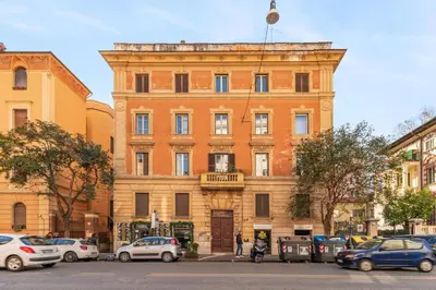 a large building with cars parked in front of it at Vatican Lovely 2BR Apartment with Terrace in Rome