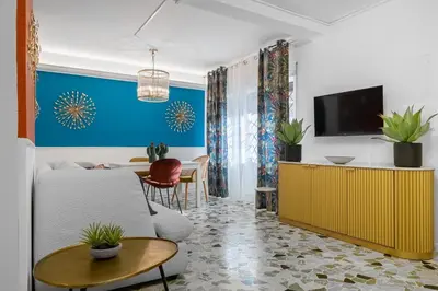 a living room with a couch and a table at Flaminio Charme Apartment in Rome