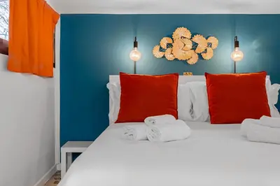 a bedroom with a bed with towels on it at Flaminio Charme Apartment in Rome