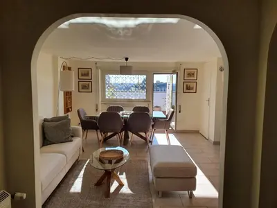 a living room with a couch and a table at Appartamento 