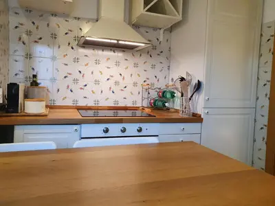a kitchen with a white stove top oven next to a counter at Appartamento 