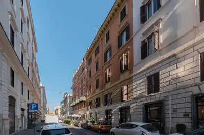 a city street with cars parked in front of buildings at GuestHost - Piazzale delle Provincie Apartment in Rome