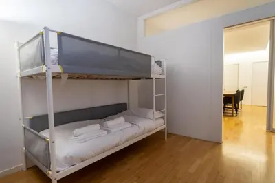 a bunk bed in a room with a mirror at ArtStay - Luxury Penthouse Metro B, Tiburtina in Rome