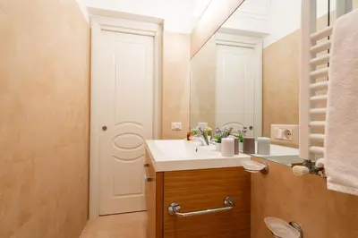 a bathroom with a sink and a mirror at Orso 70 apartment in Rome