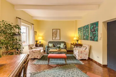 a living room with chairs and a couch at Amazing penthouse with terrace near Navona Square in Rome