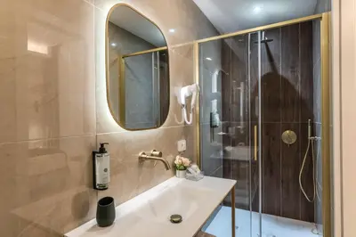 a bathroom with a sink and a shower at Goldoni 47 in Rome