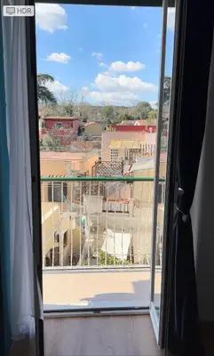 a view of a city from a window at Casetta Tuscolana in Rome