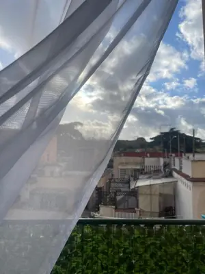 a view of a city from a window at Casetta Tuscolana in Rome
