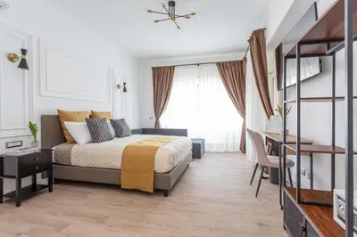 a bedroom with a bed and a desk at Rhome Vatican Rooms in Rome