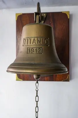 an old bell hanging on a wall at Trastevere Characteristic Roman Home in Rome