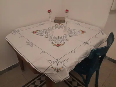a table with a white table cloth on it at Delizioso appartamento al Pigneto in Rome
