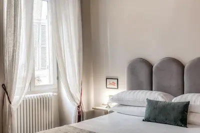 a bedroom with a bed and a window at Residenza Brama - Art ApartHotel in Rome