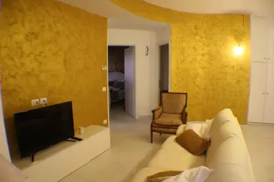 a living room with a couch and a tv at Conny's Home in Rome