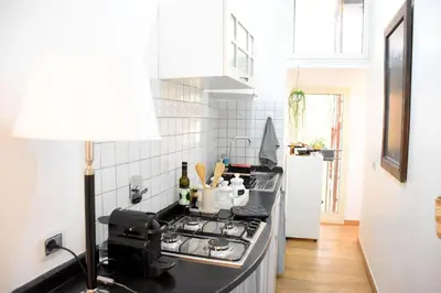 a kitchen with a stove and a counter top at Spanish Steps-Trevi -Luma Suite in Rome