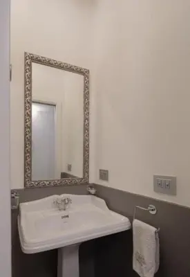a bathroom with a white sink and a mirror at Spanish Steps-Trevi -Luma Suite in Rome