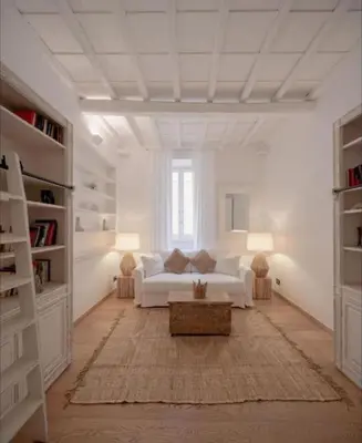a white living room with a couch and a table at Spanish Steps-Trevi -Luma Suite in Rome