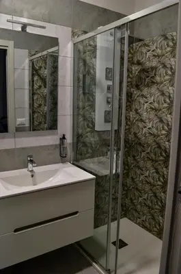 a bathroom with a sink and a shower at Nives House Roma in Rome