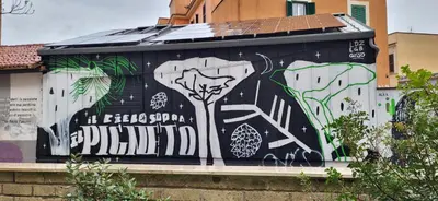 a wall with a painting of a tree on it at La Casetta con giardino al Pigneto in Rome