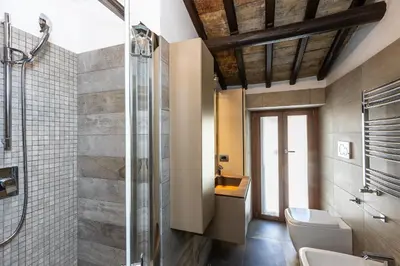 a bathroom with a toilet and a shower at Mou Trastevere House by Rental in Rome in Rome