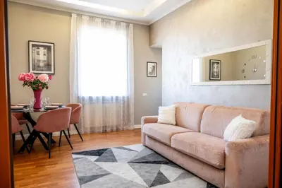 a living room with a couch and a table at INTERNO 39 - San Pietro in Rome