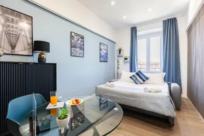a hotel room with a bed and a glass table at Hostly-ColorHome Rome Midtown in Rome