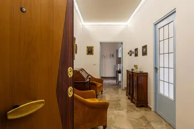 a hallway with a door and a living room at GuestHost - 4 Winds Holiday Rental in Rome
