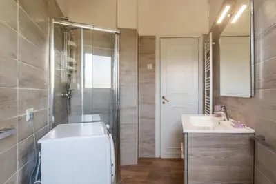 a bathroom with a tub and a sink and a shower at GuestHost - 4 Winds Holiday Rental in Rome