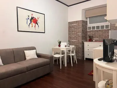 a living room with a couch and a table at Casina Dacia in Rome