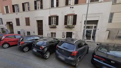 a group of cars parked in front of a building at Casina Dacia in Rome