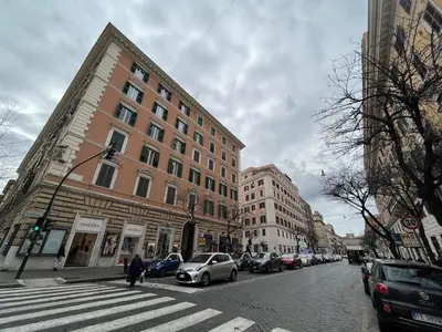a city street with cars parked on the street at interno 18 penthouse in Rome