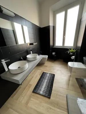 a bathroom with two sinks and two toilets at interno 18 penthouse in Rome