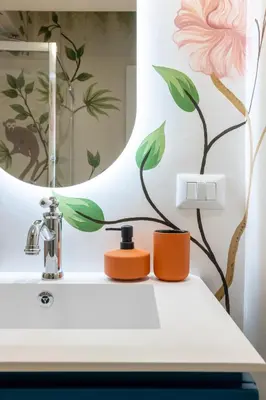 a bathroom with a sink and a mirror at Leonina Apt - Colosseum in Rome