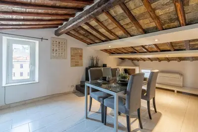 a hallway of a building with a wooden ceiling at [15 min from Piazza Venezia] Skyline Sanctuary in Trastevere in Rome