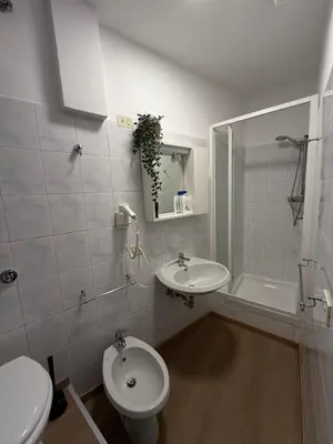 a room with a bedroom with a desk and a television at Casa Felice a piazza Zama in Rome