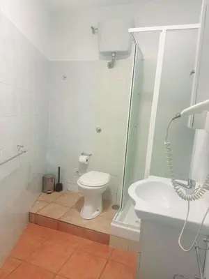 a room with a piano and a bed and a sink at Casa Felice a piazza Zama in Rome