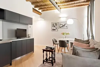 a living room with a couch and a table at HostMe Piazza Navona Apartament in Rome