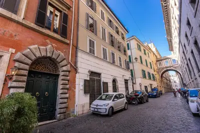 a small car parked on a street next to buildings at Domus Mondrian Luxury House in Rome