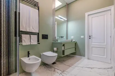 a bathroom with a sink and a mirror at The Romulus in Rome